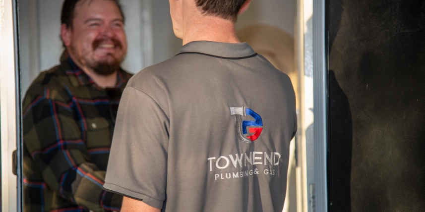 Got a Plumbing or Gas Problem Ashley Townend greeting a customer at their front door