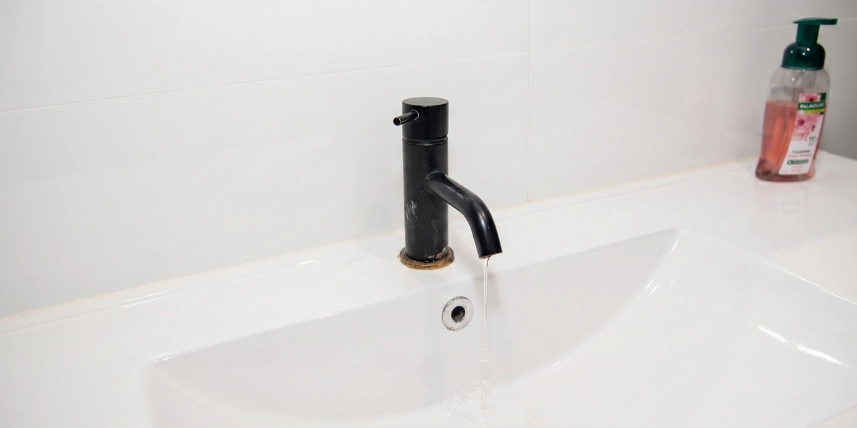 Worn bathroom tap dripping and rust-stained before repair by Townend Plumbing & Gas